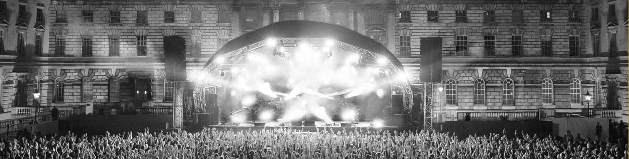 Somerset House concert stage with lights and crowd, Summer’s evening music event.