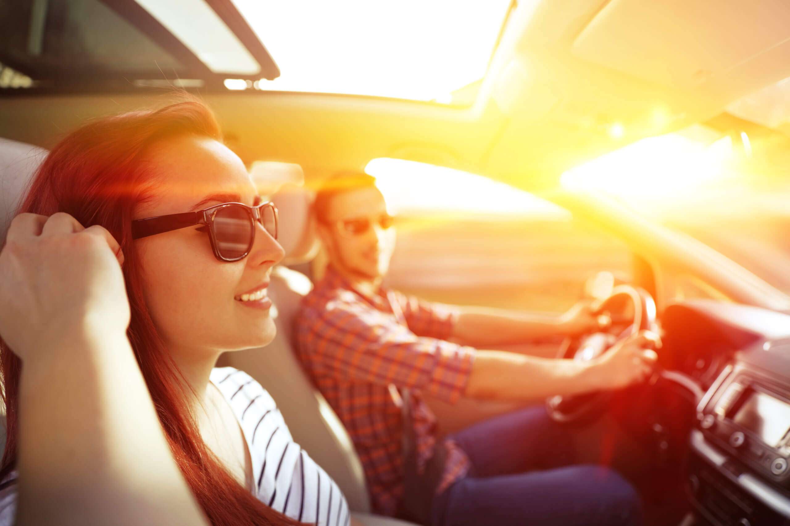 Couple enjoying chauffeur-driven car ride, luxury travel and sightseeing.