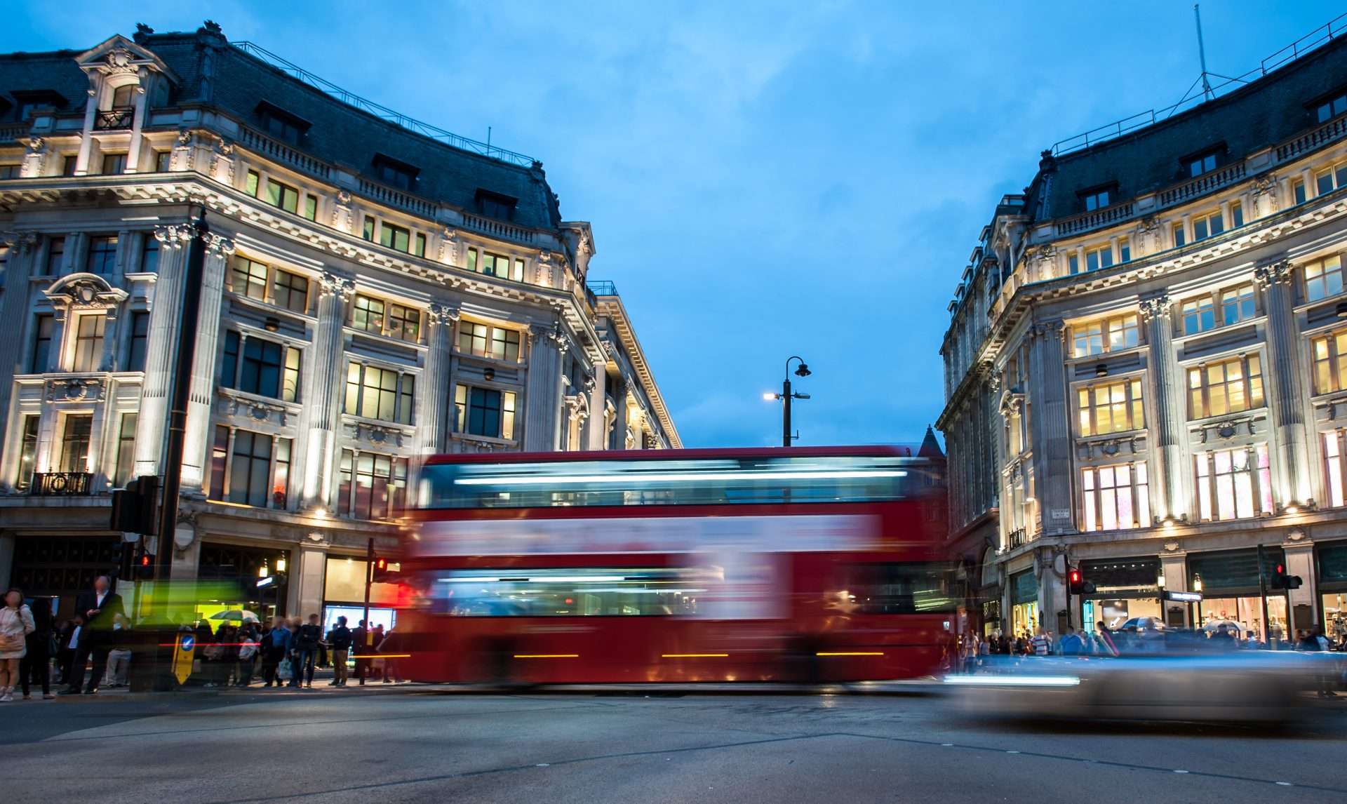 London cityscape and red double-decker bus illustrating airport transfers and city travel.